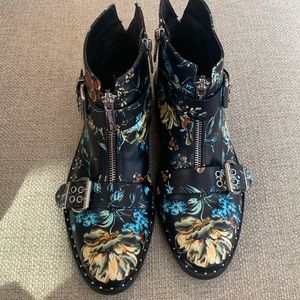 Gianni Bini leather ankle boots in black with multi-color flower pattern.